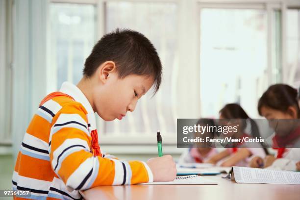 schoolchildren in class - orange bandana stock pictures, royalty-free photos & images