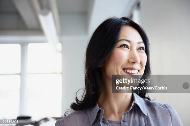 optimistic businesswoman - portrait candid ストックフォトと画像