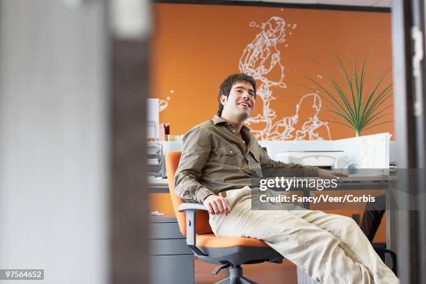 businessman at his desk - khaki trousers stock pictures, royalty-free photos & images