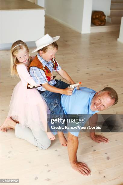 father and children playing - horses playing stock pictures, royalty-free photos & images