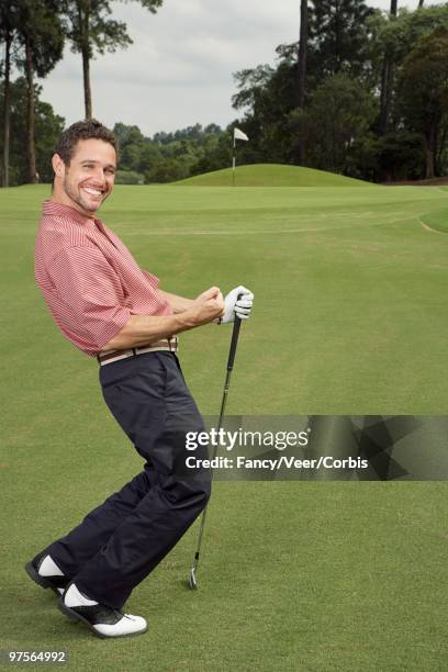 man playing golf - bent golf club stock pictures, royalty-free photos & images