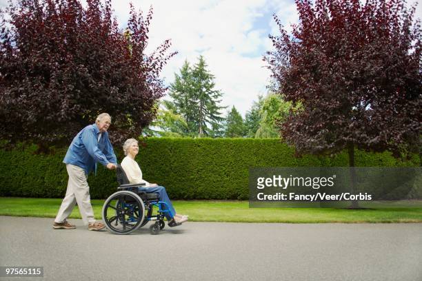 senior couple - wheelchair division stock pictures, royalty-free photos & images