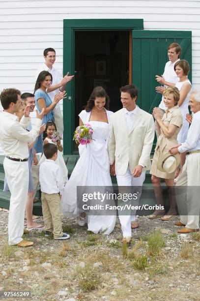 newlyweds leaving church - leaving church stock pictures, royalty-free photos & images