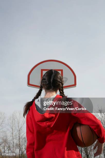 girl looking at basketball hoop - children only braided ponytail stock pictures, royalty-free photos & images