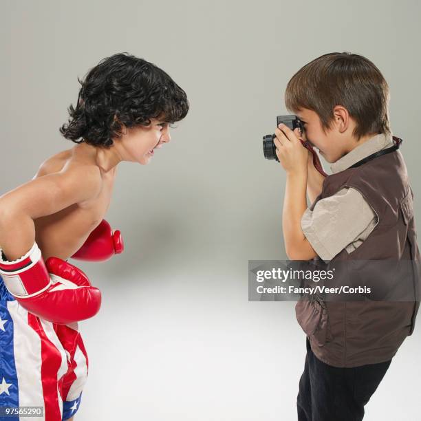 boy taking a picture of a boxer - boksbroek stockfoto's en -beelden