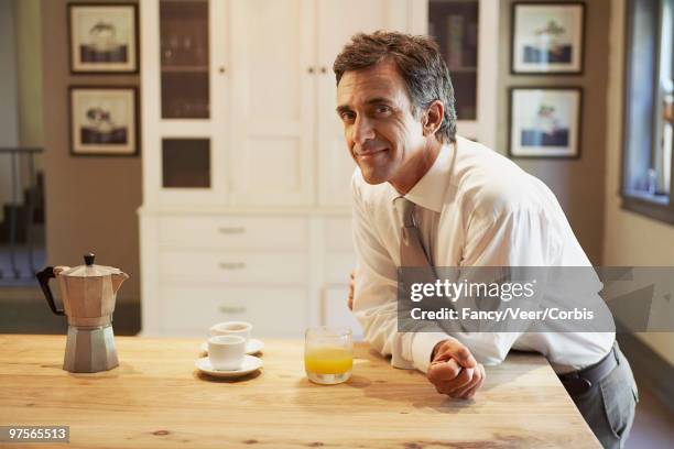 man having breakfast - luxury home dining table people lifestyle photography people stock pictures, royalty-free photos & images