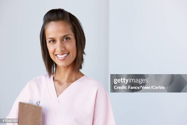 nurse smiling - nurse and portrait and white background and smiling and female and looking at camera stock pictures, royalty-free photos & images