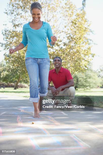 carefree couple - black male feet stockfoto's en -beelden