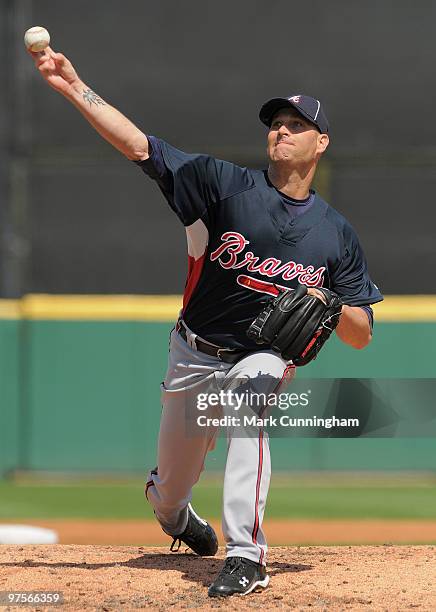 Tim Hudson of the Atlanta Braves pitches against the Detroit Tigers during a spring training game at Joker Marchant Stadium on March 8, 2010 in...