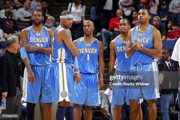 Nene ##1, Carmelo Anthony, Chauncey Billups, Arron Afflalo Malik Allen of the Denver Nuggets huddle on the court during the game against the Golden...