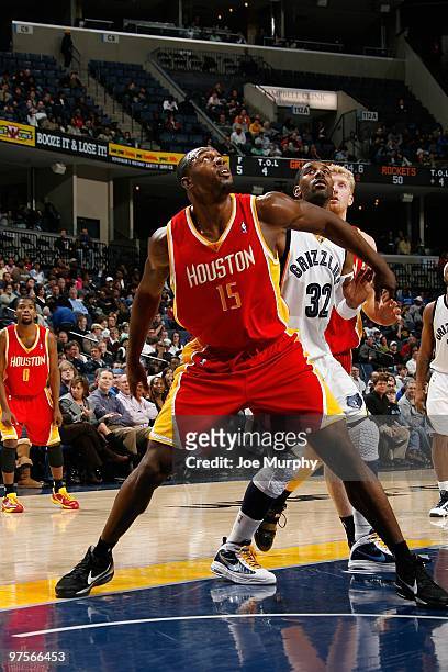 Joey Dorsey of the Houston Rockets rebounds against O.J. Mayo of the Memphis Grizzlies during the game on February 5, 2010 at FedExForum in Memphis,...