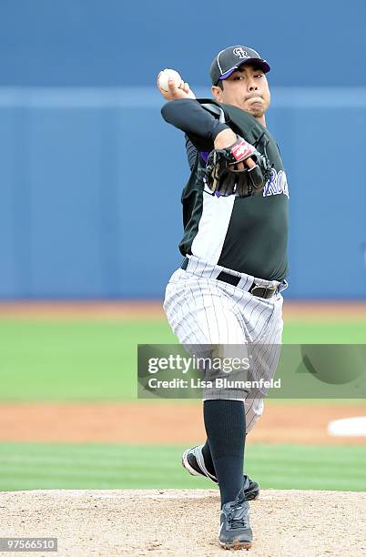 Jorge De La Rosa of the Colorado Rockies pitches during a Spring Training game against the San Diego Padres on March 8, 2010 at Peoria Stadium in...