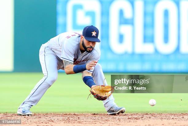 Marwin Gonzalez of the Houston Astros fields a ground ball in the third inning against the Texas Rangers at Globe Life Park in Arlington on June 9,...