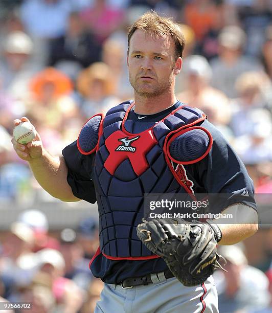 David Ross of the Atlanta Braves looks on against the Detroit Tigers during a spring training game at Joker Marchant Stadium on March 8, 2010 in...