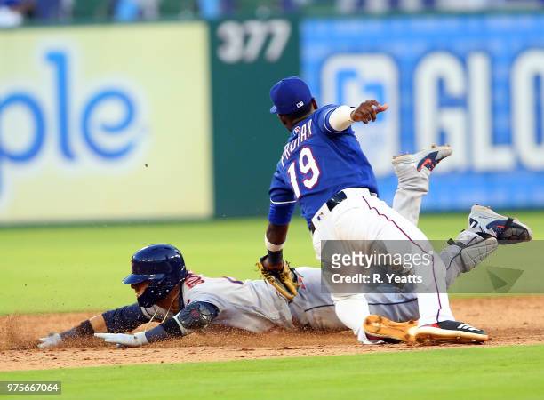 Jurickson Profar of the Texas Rangers tags out Yuli Gurriel of the Houston Astros in the sixth inning at Globe Life Park in Arlington on June 9, 2018...