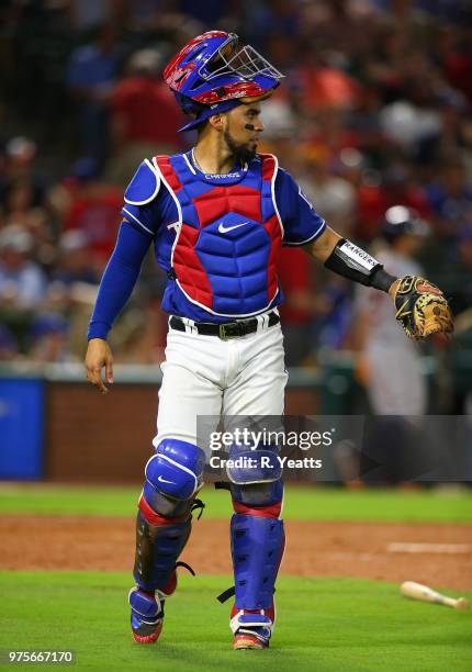 Robinson Chirinos of the Texas Rangers looks on during in the seventh inning against the Houston Astros at Globe Life Park in Arlington on June 9,...