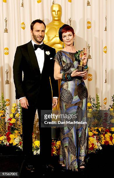 Director Tom Ford and designer Sandy Powell, winner of the Best Costume Design Award for "The Young Victoria" pose in the press room at the 82nd...