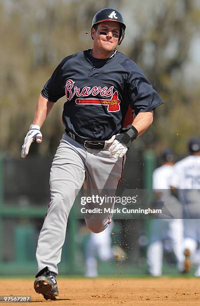 Matt Diaz of the Atlanta Braves runs the bases against the Detroit Tigers during a spring training game at Joker Marchant Stadium on March 8, 2010 in...