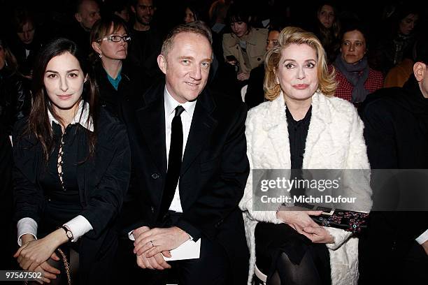 Amira Casar, Francois Henri Pinault and Catherine Deneuve during the Yves Saint-Laurent Ready to Wear show as part of the Paris Womenswear Fashion...