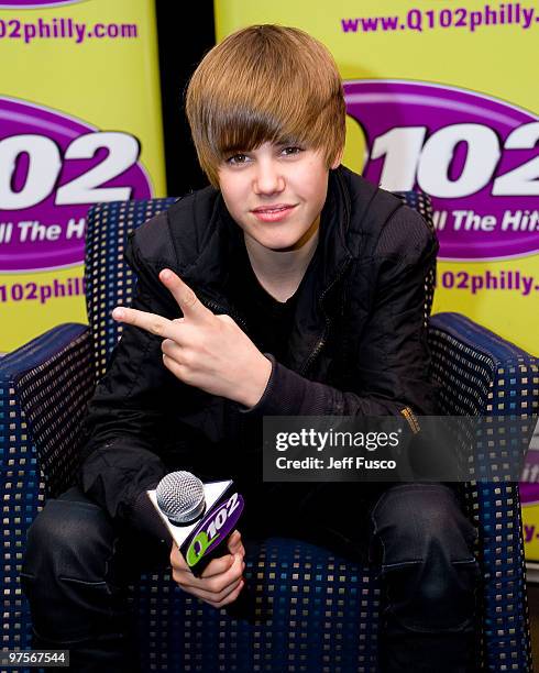 Justin Bieber poses during a meet and greet to promote his new CD ' My World 2.0' at the Q102 radio station on March 8, 2010 in Bala Cynwyd,...