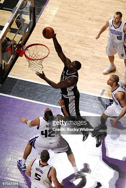 DeJuan Blair of the San Antonio Spurs shoots a layup against Sean May of the Sacramento Kings during the game at Arco Arena on February 3, 2010 in...