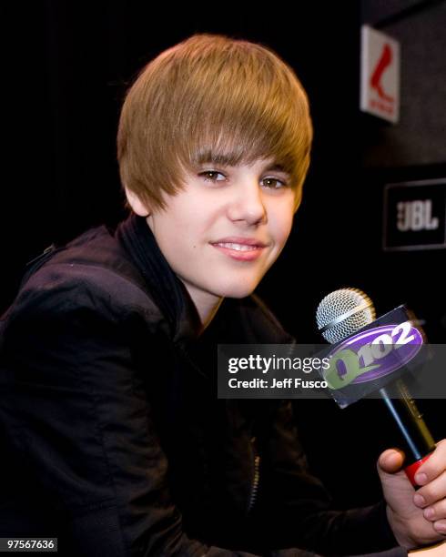 Justin Bieber poses during a meet and greet to promote his new CD ' My World 2.0' at the Q102 radio station on March 8, 2010 in Bala Cynwyd,...