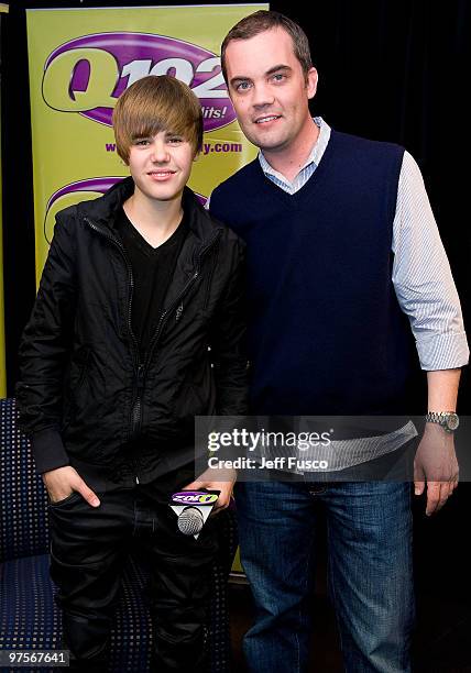 Justin Bieber poses with Romeo during a meet and greet to promote his new CD ' My World 2.0' at the Q102 radio station on March 8, 2010 in Bala...