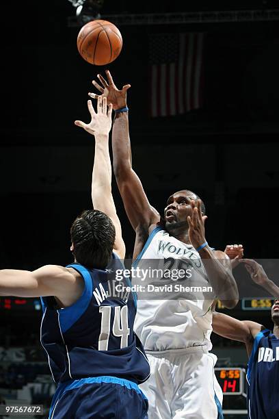 Al Jefferson of the Minnesota Timberwolves shoots over Eduardo Najera of the Dallas Mavericks during the game on March 8, 2010 at the Target Center...