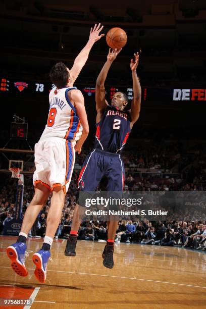 Joe Johnson of the Atlanta Hawks shoots against Danilo Gallinari of the New York Knicks on March 8, 2010 at Madison Square Garden in New York City....