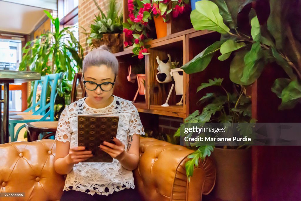 A lady reading a menu