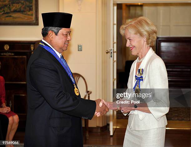 Indonesian President Susilo Bambang Yudhoyono is congratulated by Governor General Quentin Bryce after being appointed an Honorary Companion in the...