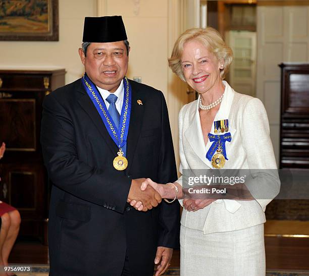 Indonesian President Susilo Bambang Yudhoyono is congratulated by Governor General Quentin Bryce after being appointed an Honorary Companion in the...