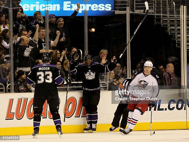 Wayne Simmonds of the Los Angeles Kings celebrates his goal with Fredrik Modin and Anton Stralman of the Columbus Blue Jackets skates past on March...