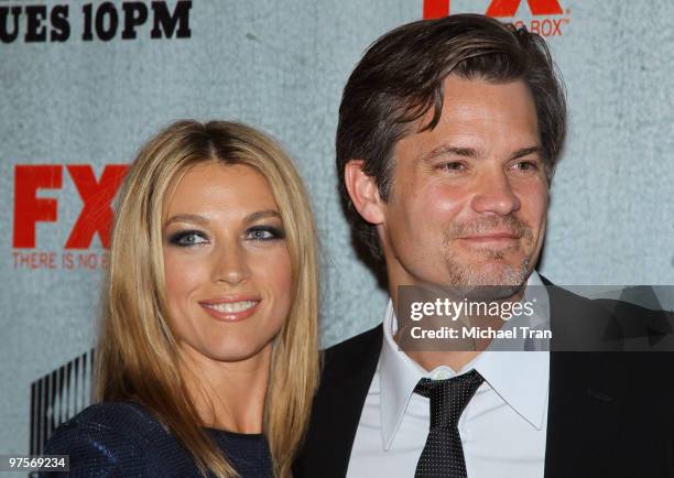 Natalie Zea and Timothy Olyphant arrive at the Los Angeles premiere screening of FX's "Justified" held at Directors Guild Theatre on March 8, 2010 in...