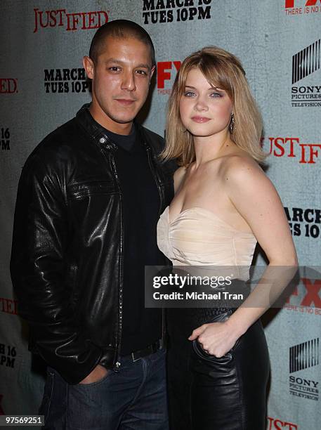 Theo Rossi and Sarah Jones arrive at the Los Angeles premiere screening of FX's "Justified" held at Directors Guild Theatre on March 8, 2010 in West...