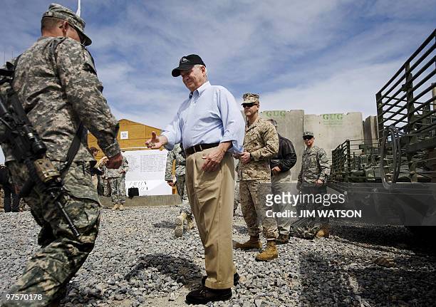 Secretary of Defense Robert Gates presents coins to 1st Battalion, 17th Infantry Regiment, troops at Forward Operating Base Frontenac in Kandahar on...