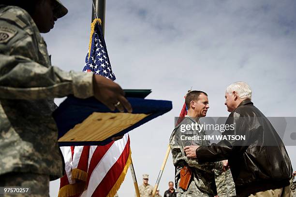 Secretary of Defense Robert Gates pins the Silver Star on US Army Task Force Commander LT Colonel Mike Morgan, of Task Force Saber, during an award...
