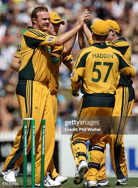 Doug Bollinger of Australia celebrates bowling Brendon McCullum of New Zealand during the One Day International match between New Zealand and...