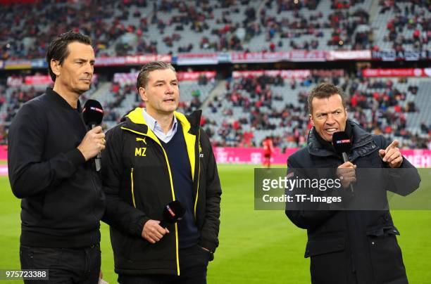 Sebastian Hellmann, Manager Michael Zorc of Dortmund and Lothar Matthaeus look on prior to the Bundesliga match between FC Bayern Muenchen and...
