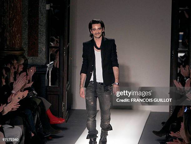 French designer Christophe Decarnin acknowledges the public after thr Balmain autumn-winter 2010/2011 ready-to-wear collection show on March 4, 2010...