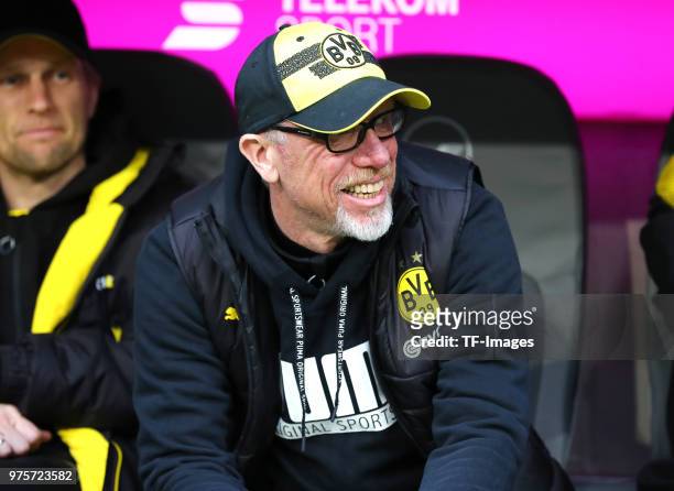 Head coach Peter Stoeger of Dortmund sits on the bench prior to the Bundesliga match between FC Bayern Muenchen and Borussia Dortmund at Allianz...