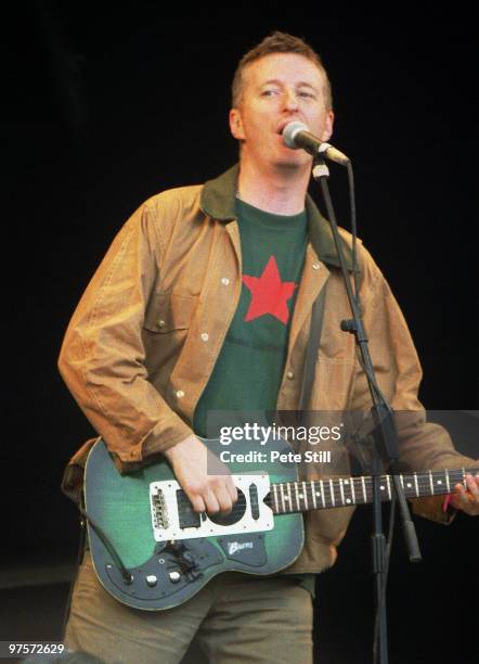 Billy Bragg performs on stage at the Glastonbury Festival on June 28th, 1997 in Glastonbury, England.