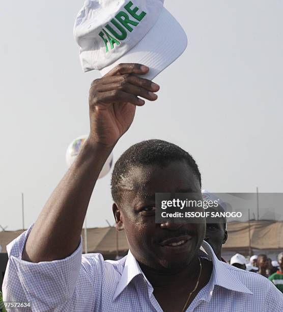 Togo�s outgoing President Faure Gnassingbe greets the crowd during a presidential campaign rally on March 1, 2010 in Lome. Gnassingbe's second term...