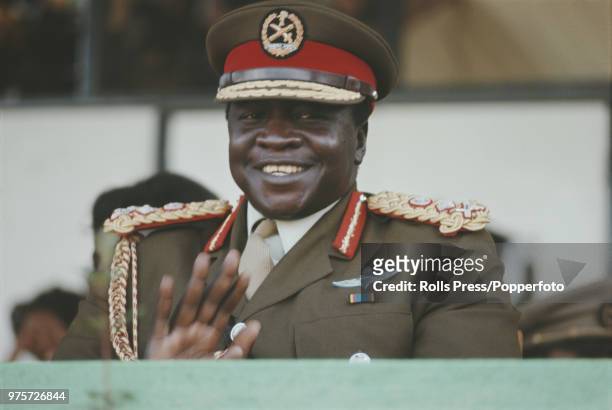 President of Uganda, Idi Amin pictured applauding at a military event in Kampala, Uganda in August 1972.