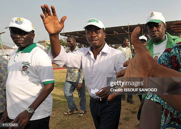 Togo�s outgoing President Faure Gnassingbe waves to the crowd during a presidential campaign rally on March 1, 2010 in Lome. Gnassingbe's second term...