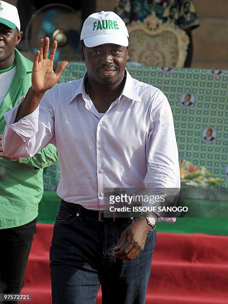 Togo�s outgoing President Faure Gnassingbe greets the crowd during a presidential campaign rally on March 1, 2010 in Lome. Gnassingbe's second term...