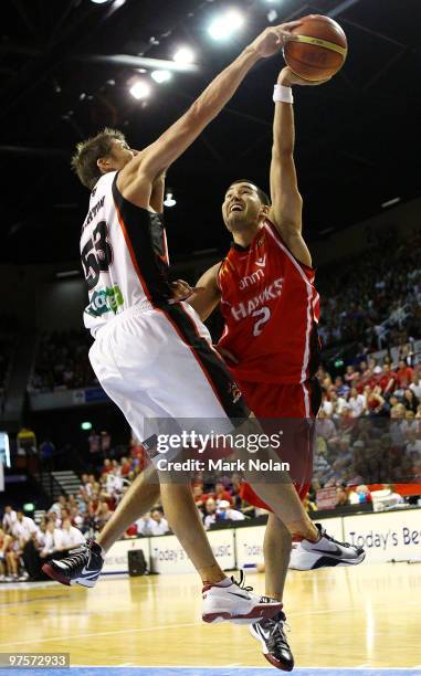 Damian Martin of the Wildcats blocks the shot of Luke Martin of the Hawks during game two of the NBL Grand Final Series at the Wollongong...