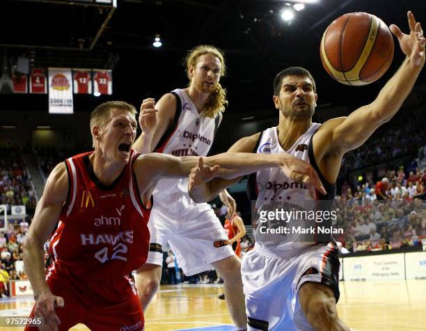 David Gruber of the Hawks and Kevin Lisch of the Wildcats contest possession during game two of the NBL Grand Final Series at the Wollongong...