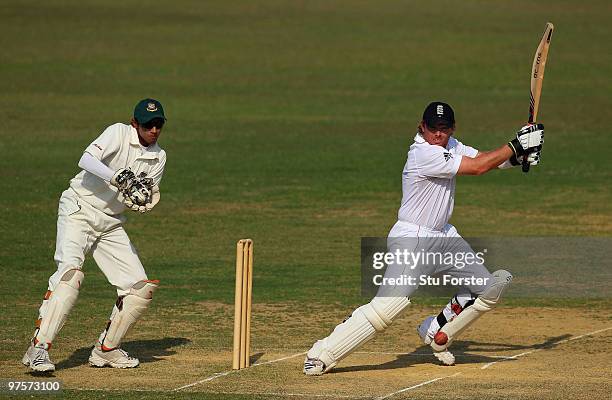 England batsman Ian Bell cuts a ball to the boundary watched by Bangladesh wicketkeeper Saghir Hossain during day three of the tour match between...