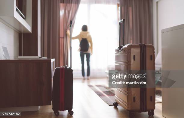 tourist woman staying in luxury hotel - hotel stock pictures, royalty-free photos & images